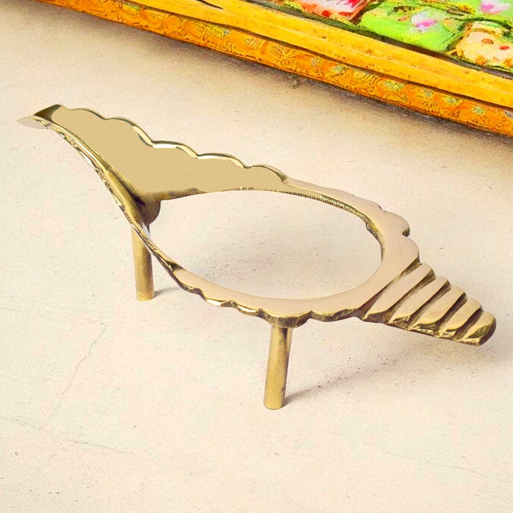 7 inch traditional brass Shankh stand with an elegant, polished finish and stable base, ideal for holding ritual conch shells in pooja setups or temple decor. India’s Largest Pooja Accessories Brand – www.satvikstore.in
