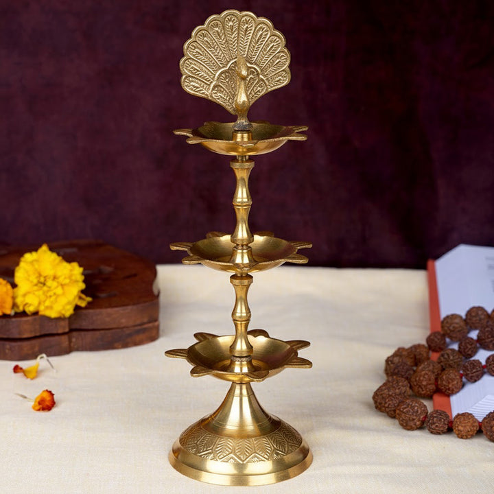 8.3 inch brass flying peacock 3 step Kerala Samai diya for pooja and temple use. India’s Largest Pooja Accessories Brand – www.satvikstore.in

