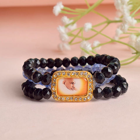 Black & Purplish Blue Triple Layer Guruji Swaroop Bracelet featuring sleek black beads with vibrant purplish blue middle layer and Jai Guruji Swaroop – perfect for spiritual wear, meditation, and gifting. India’s Largest Pooja Accessories Brand – www.satvikstore.in