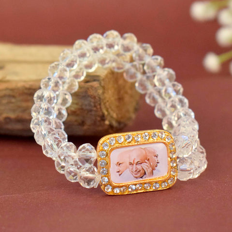 Clear Shiny Beads Single Layer Guruji Swaroop Bracelet featuring sparkling clear beads and Jai Guruji Swaroop – perfect for minimalist spiritual wear, meditation, and gifting. India’s Largest Pooja Accessories Brand – www.satvikstore.in