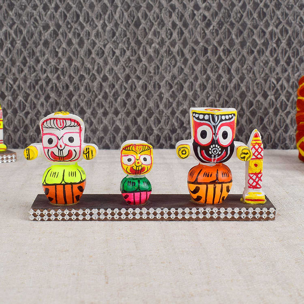 Colorful Lord Jagannath idol in vibrant traditional attire, perfect for car dashboard or home altar, symbolizing protection, devotion, and travel blessings. India’s Largest Pooja Accessories Brand - www.satvikstore.in
