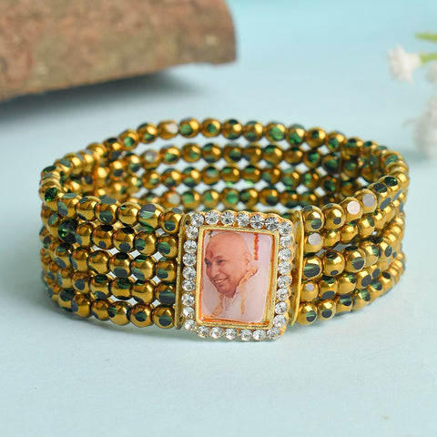 Five Layered Green & Golden Beads Guruji Swaroop Bracelet featuring vibrant layered beads and Jai Guruji Swaroop – perfect for spiritual wear, festive gifting, and daily devotion. India’s Largest Pooja Accessories Brand – www.satvikstore.in