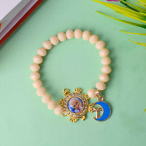 Guruji Swaroop Bracelet featuring colourful assorted beads with charms – handmade spiritual accessory perfect for pooja, gifting, and daily devotion. Satvikstore.in

